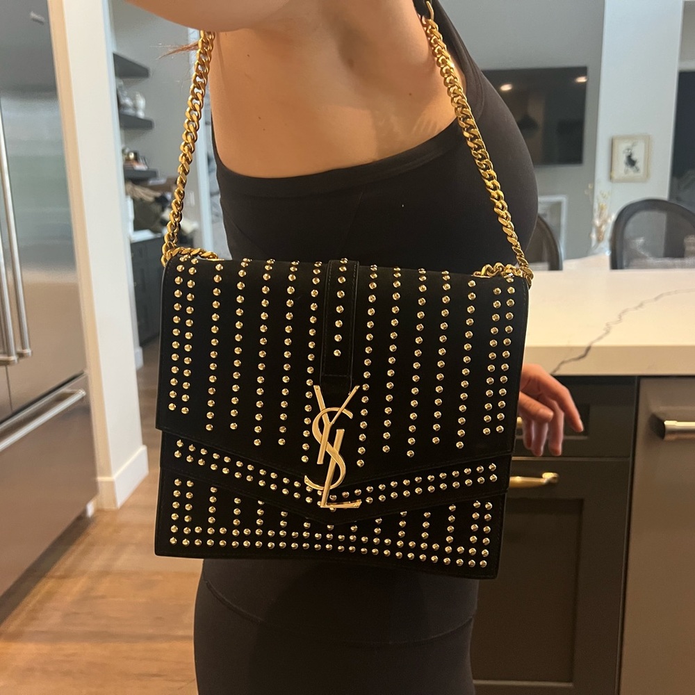 YSL handbag , black suede with gold detail and gold chain. Lightly worn!